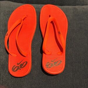 Nike Orange Flip Flops